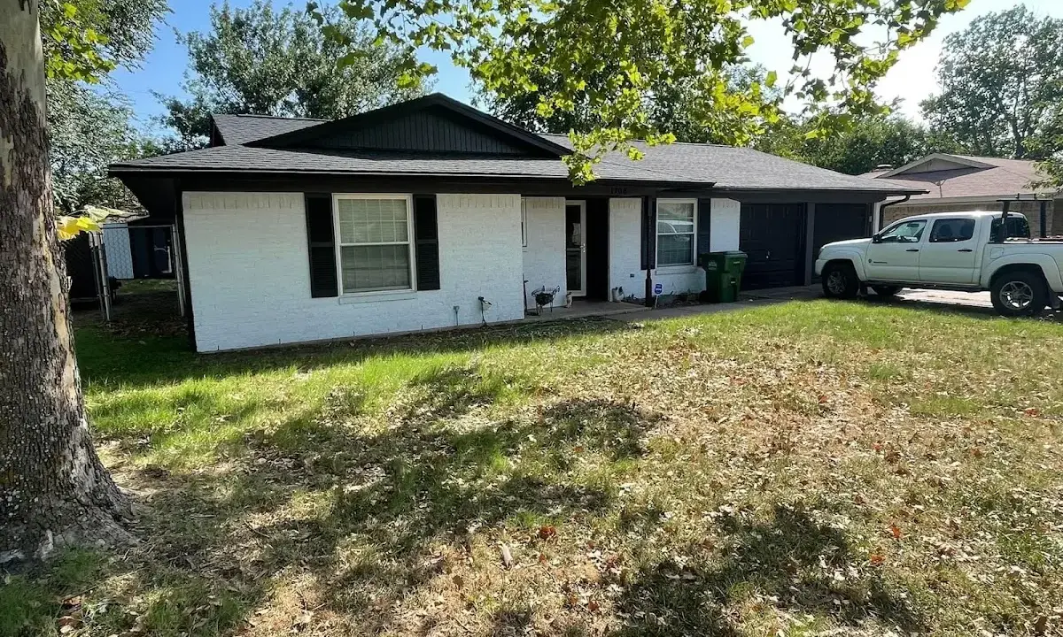 Professional roofing crew working on a residential roof in Madisonville